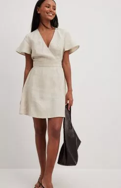 NA-KD Boho Linen Flowy Tie Back Mini Dress -Party Dresses Sales linen flowy tie back mini dress 1014 001508 0005 01